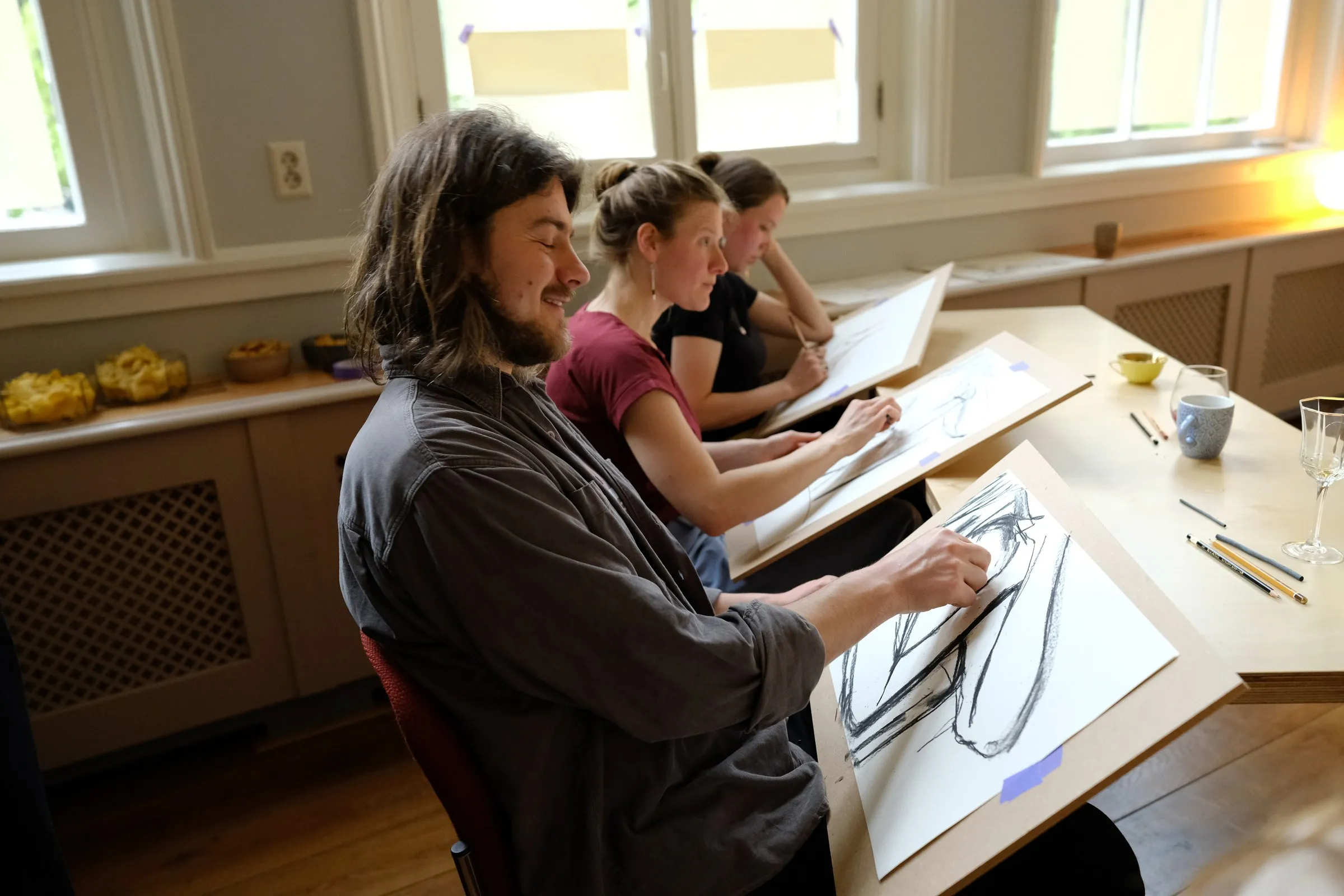 Participants drawing at the tables