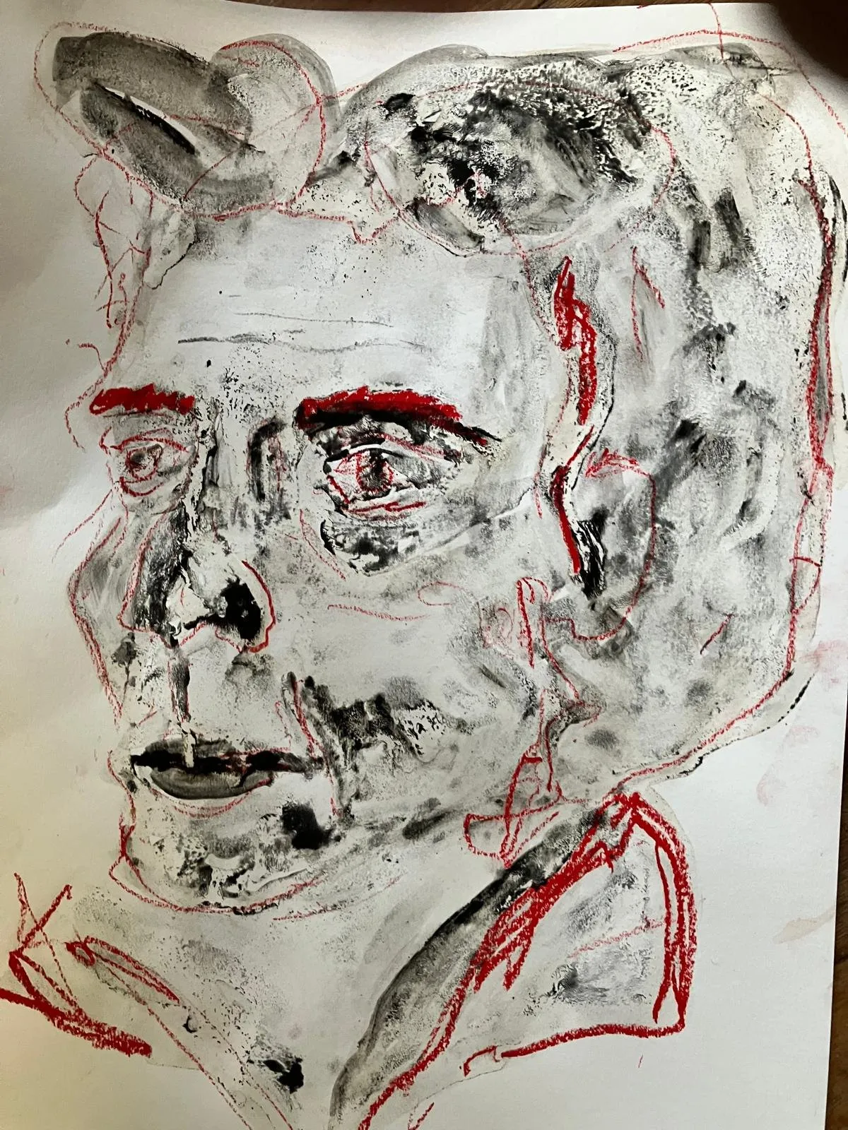 Face in charcoal with red