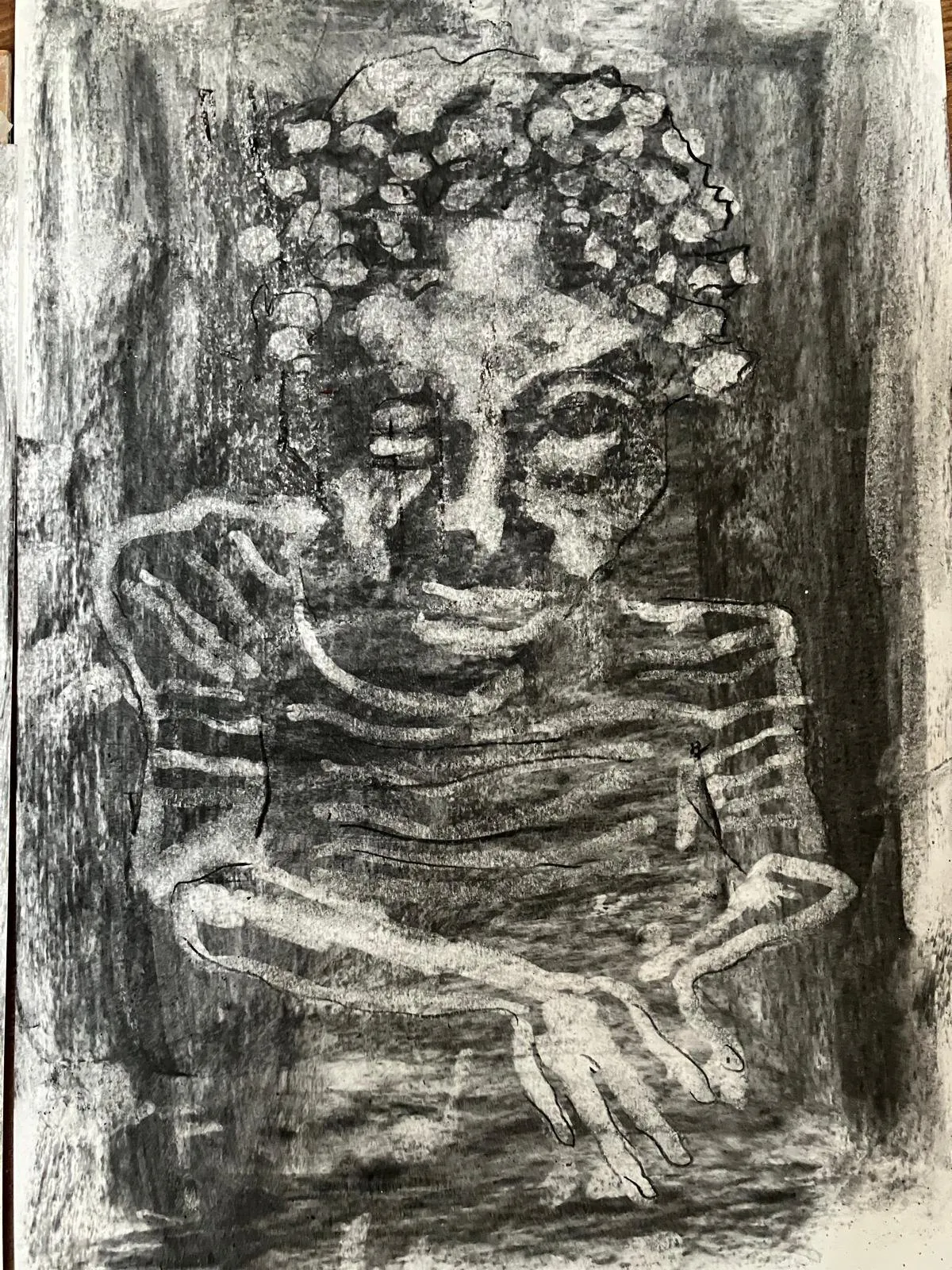 Seated figure in charcoal