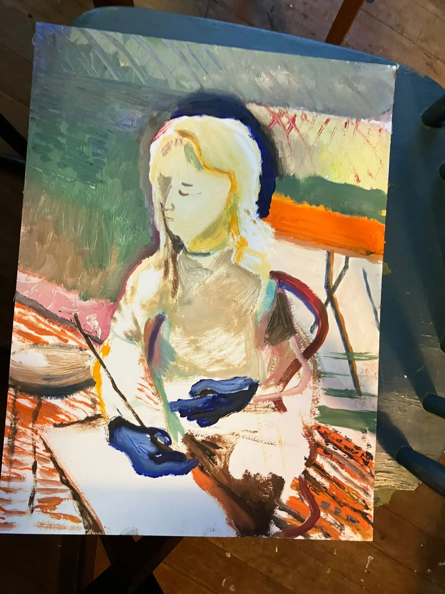 Painted figure at an easel
