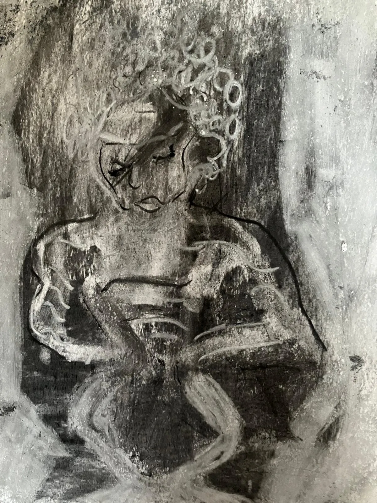 Charcoal work laid out on the floor