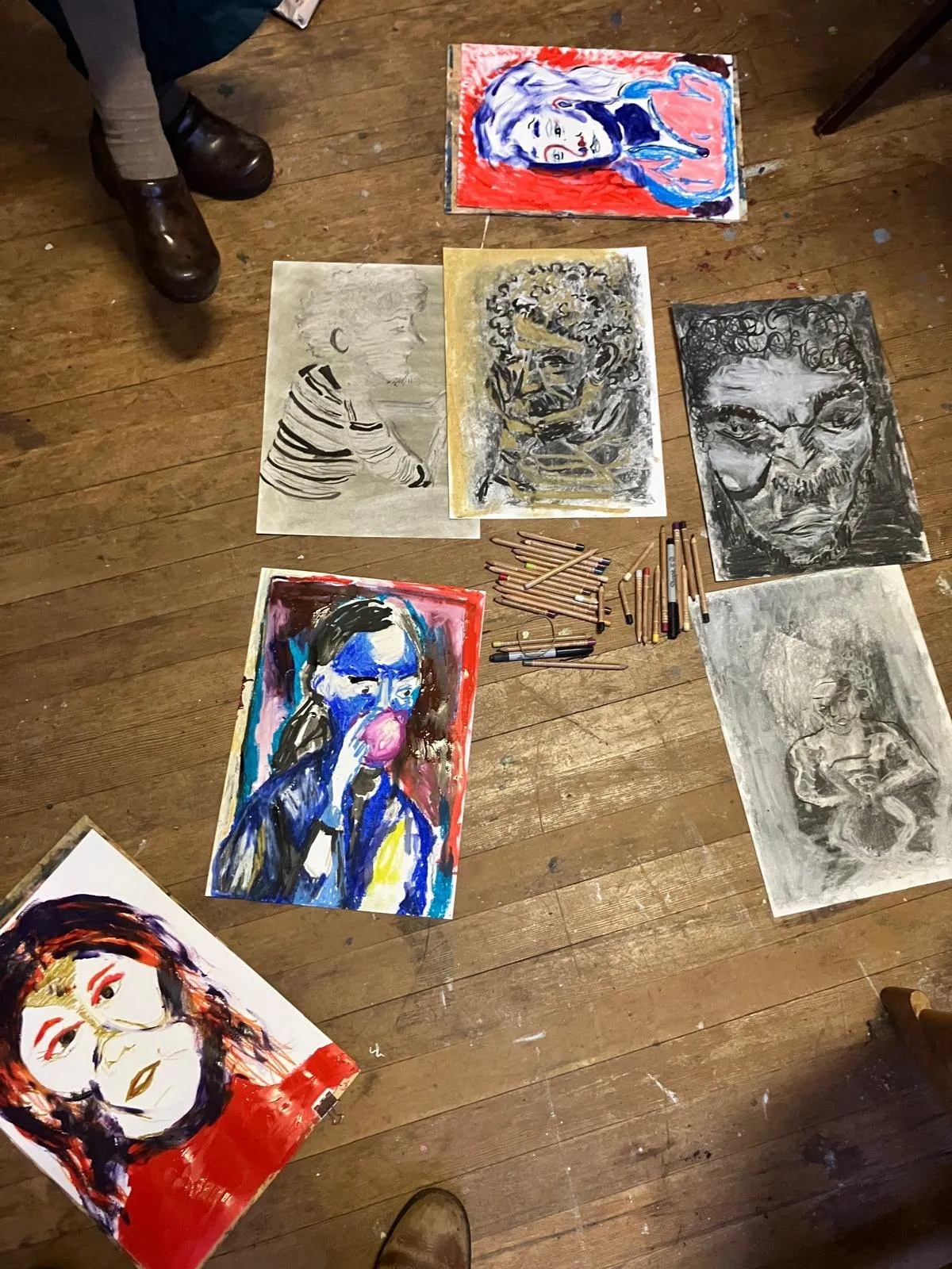 Work from a session spread out on the floor
