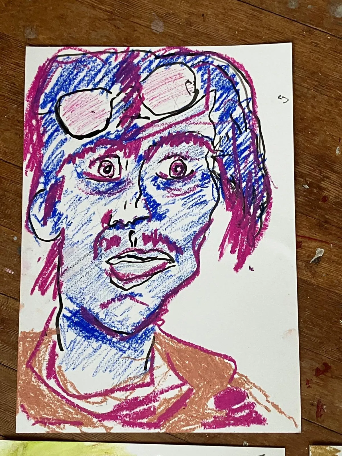 Face in pink and blue marker