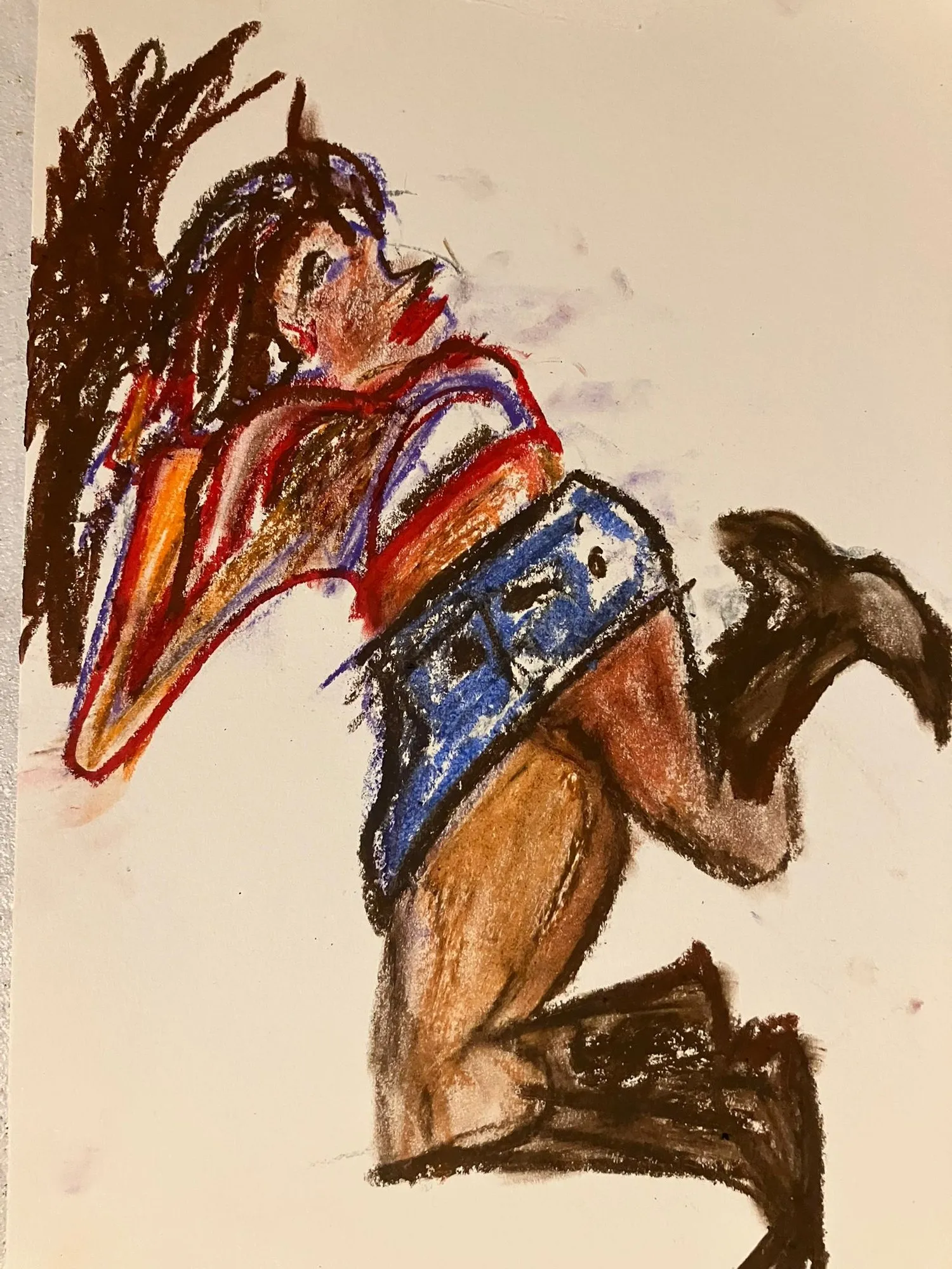 Kneeling figure in orange and blue