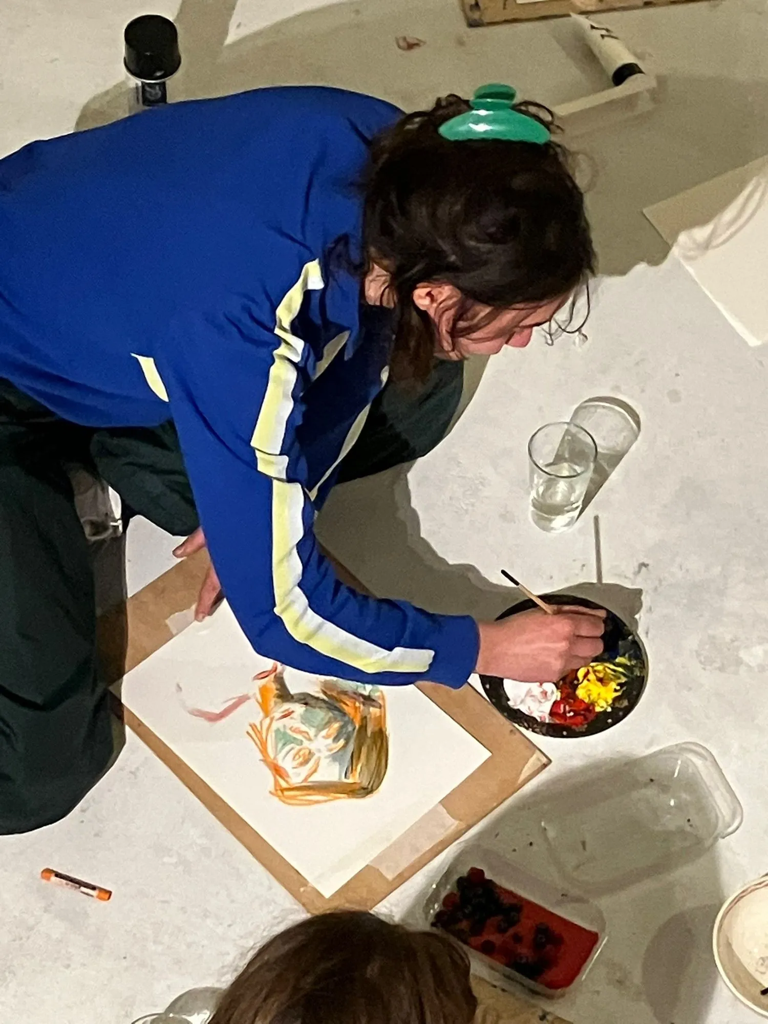 A participant painting, seen from above