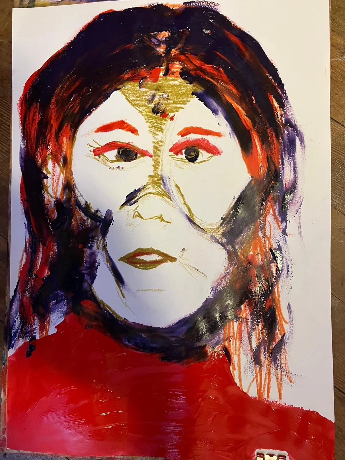 Figure in red with a pale face